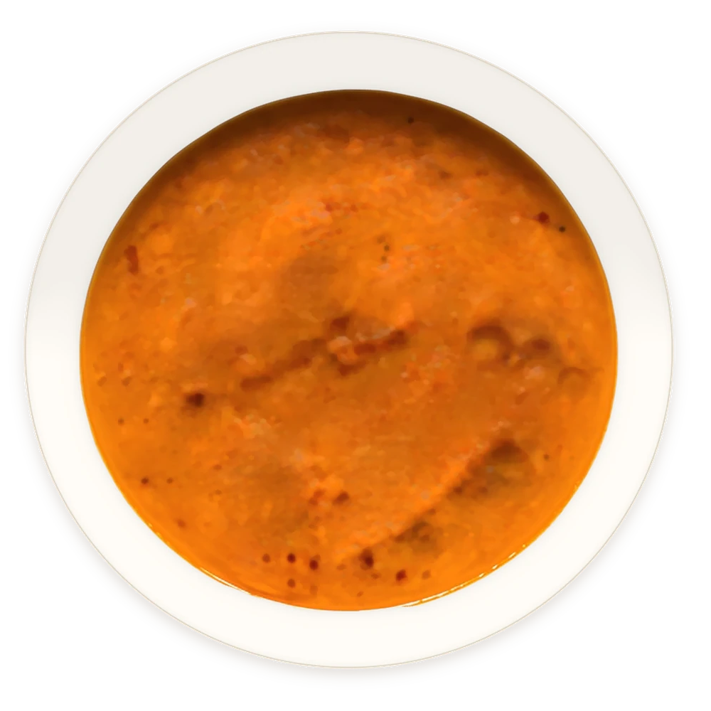 A white bowl of FITO Caramel soup from above, with baked feta letters spelling FITO appearing one by one
